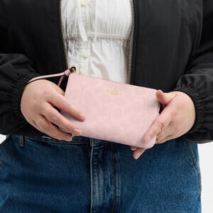 Coach Corner Zip Wristlet In Signature Canvas Powder Pink